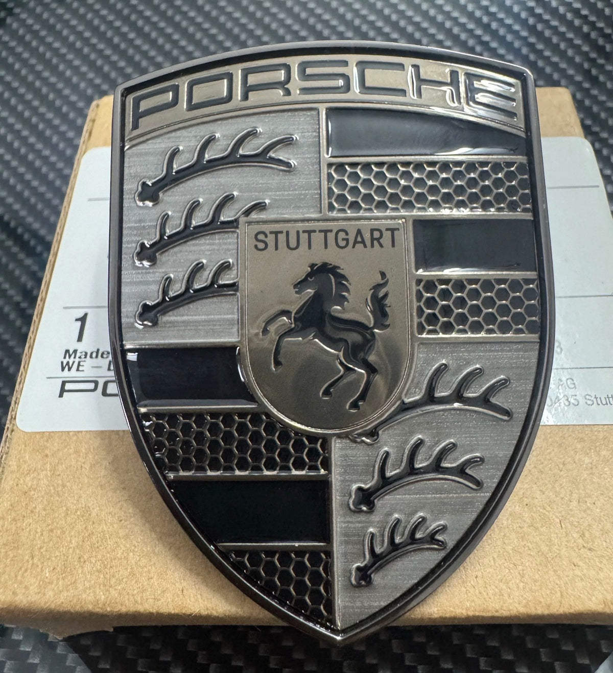 Engine cover emblem